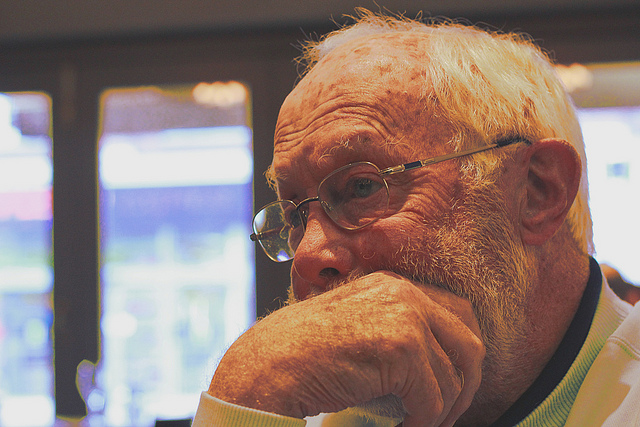 A man thinking with his chin resting on his hands