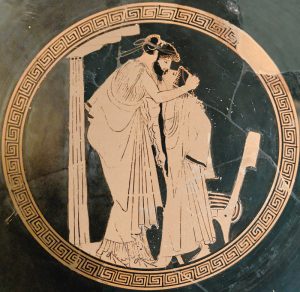 An image on an ancient Greek drinking cup of two lovers kissing. circa 480 BC.