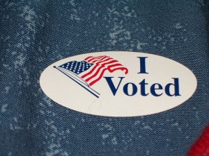 A sticker with the message "I Voted" next to an American flag.